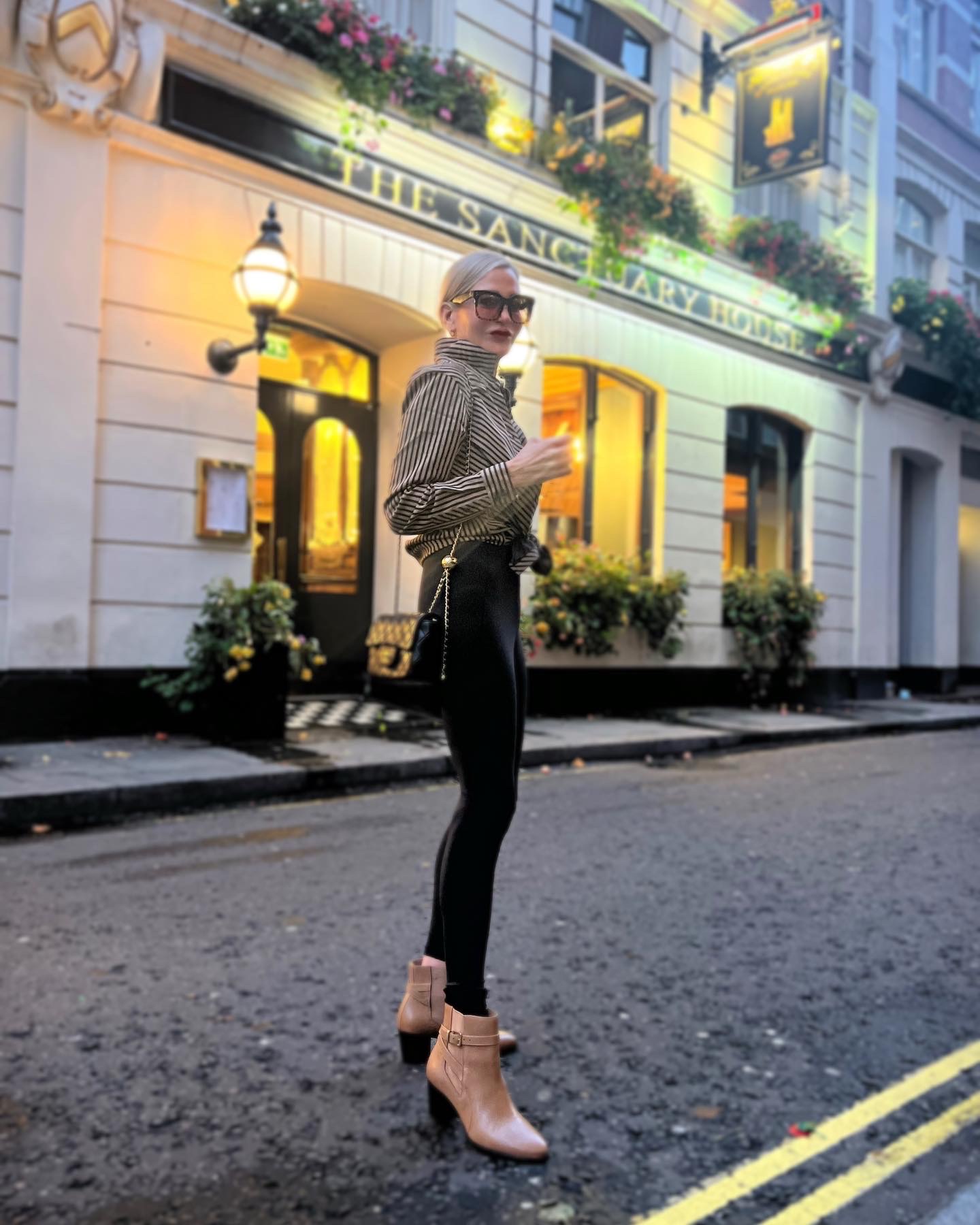 Lifestyle Influencer, Jamie Lewinger of More Than Turquoise wearing Chico's striped blouse at the Sanctuary House in London 
