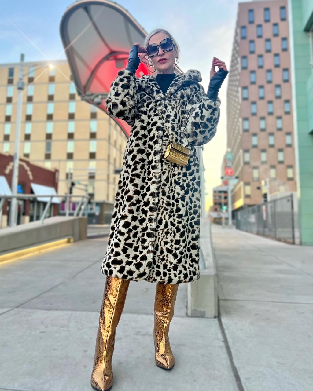 Lifestyle Influencer, Jamie Lewinger of More Than Turquoise wearing Kate Hewko snow leopard faux fur coat 