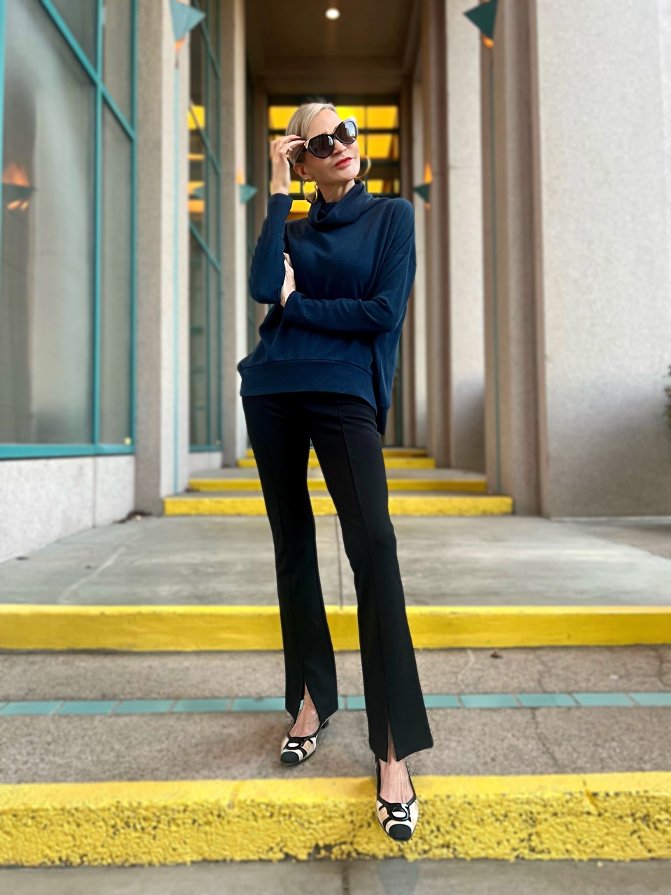 Lifestyle Influencer, Jamie Lewinger of More Than Turquoise wearing Clara Sunwoo Cowl turtleneck sweater in Midnight Blue 