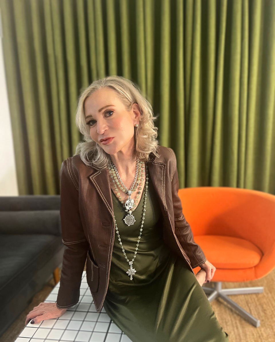 Lifestyle Influencer, Jamie Lewinger of More Than Turquoise wearing French Kande jewelry and Cabi Clothing leather jacket 
