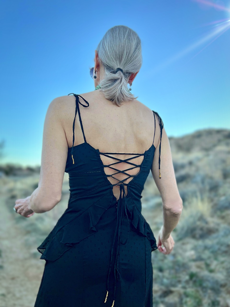 Lifestyle Influencer, Jamie Lewinger of More Than Turquoise wearing the Carey Ruffled Corset dress from Buffalo Jeans in black 