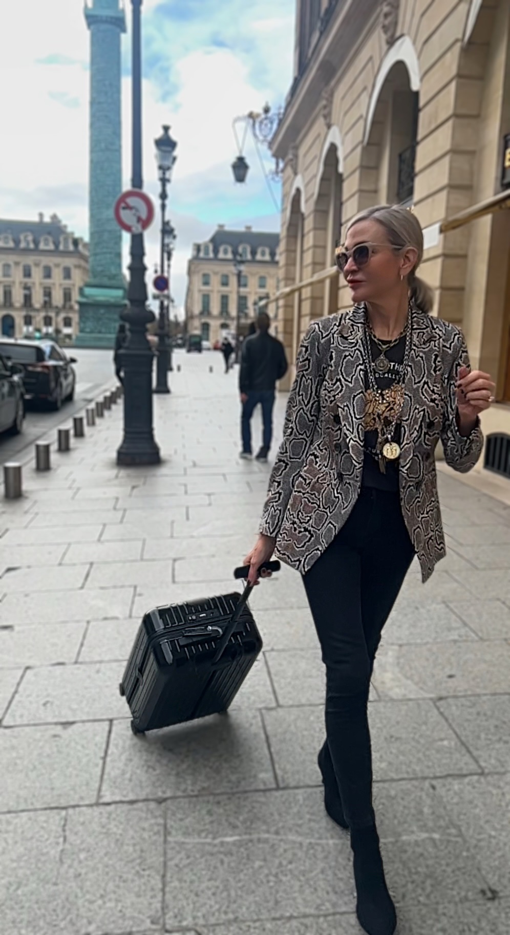 Lifestyle Influencer, Jamie Lewinger of More Than Turquoise wearing French Kande jewelry at the Place Vendome  in Paris France 