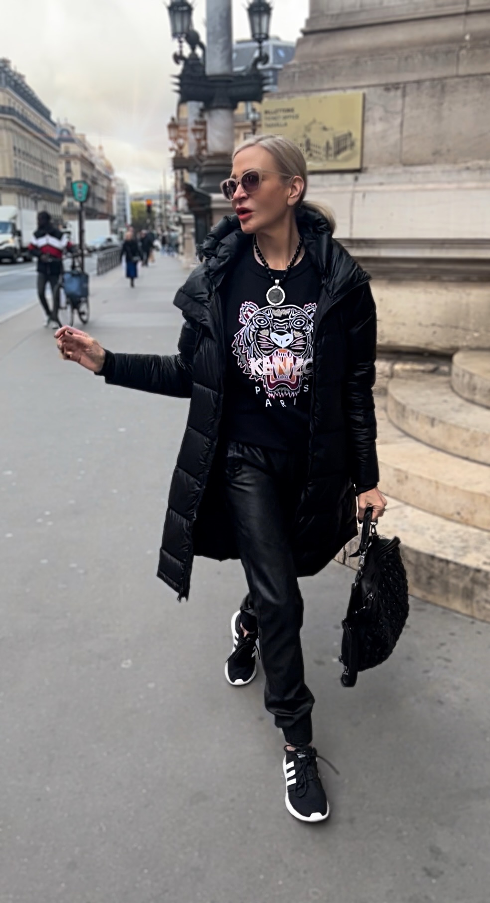 Lifestyle influencer, Jamie Lewinger of More Than Turquoise wearing French Kande faceted black onyx with ministry medallion necklace  in Paris France 