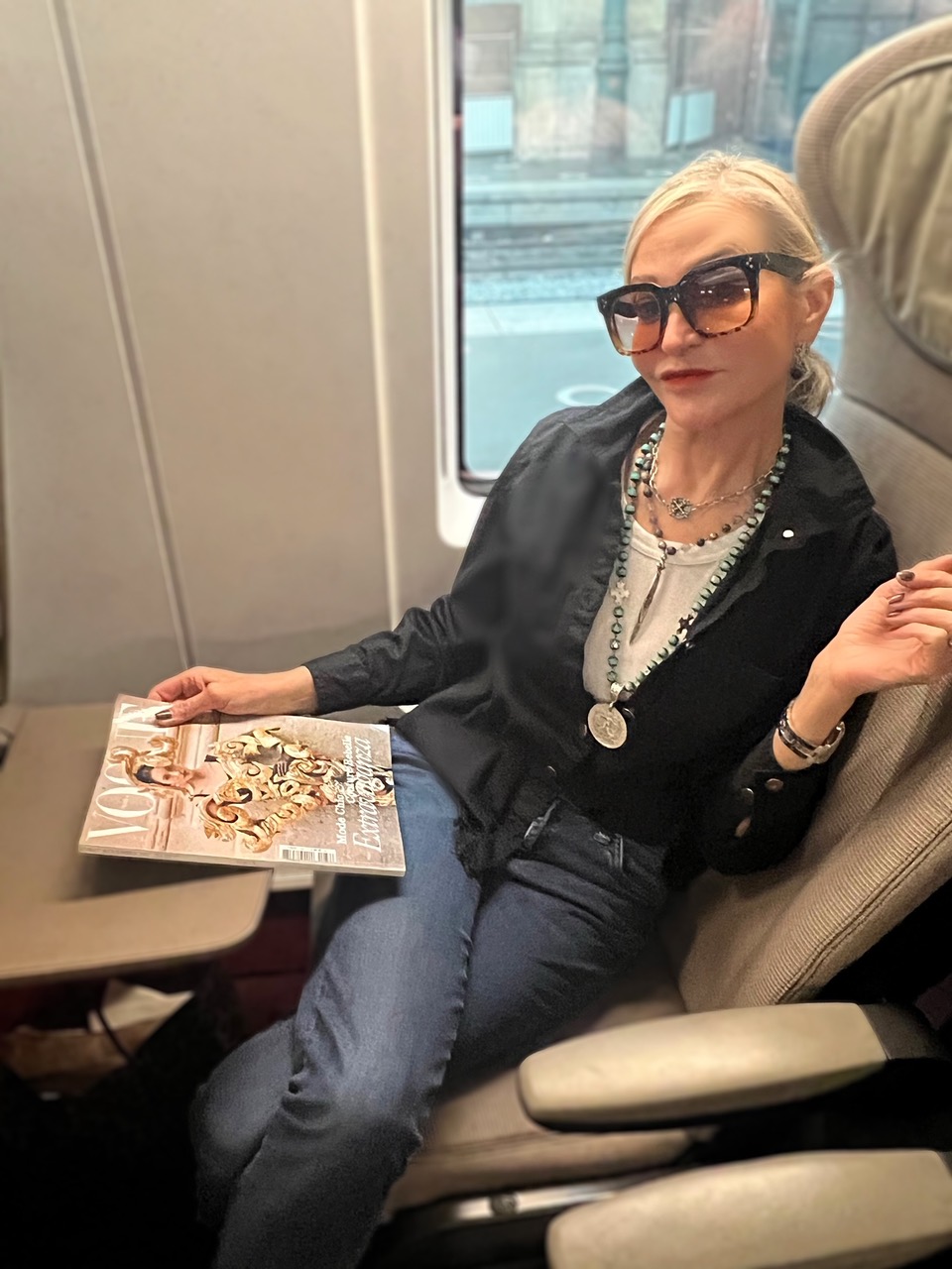 Lifestyle Influencer, Jamie Lewinger of More Than Turquoise wearing French Kande jewelry on the Eurostar Train 