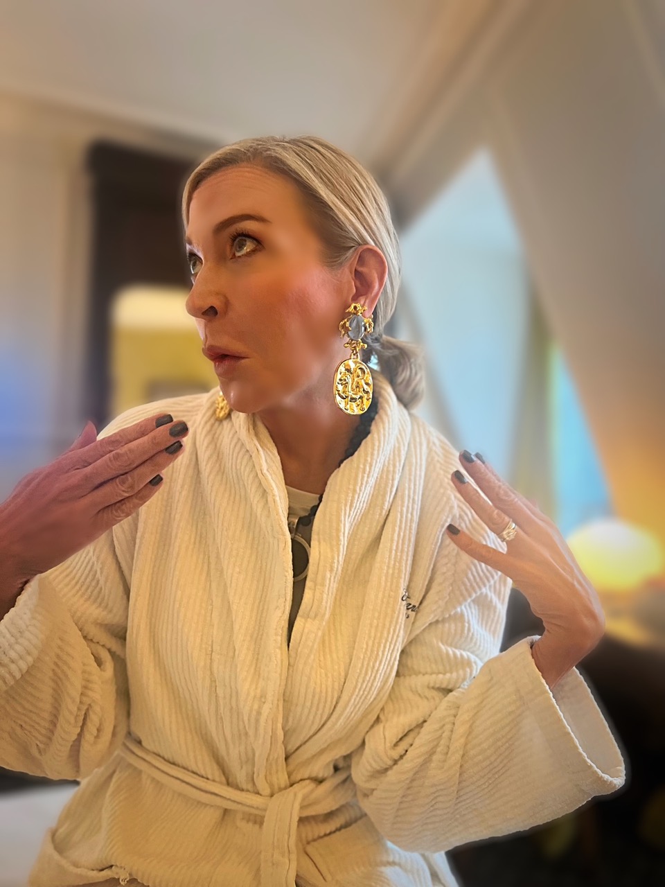 Lifestyle influencer, Jamie Lewinger of More Than turquoise wearing Gavilane earrings in Paris France 