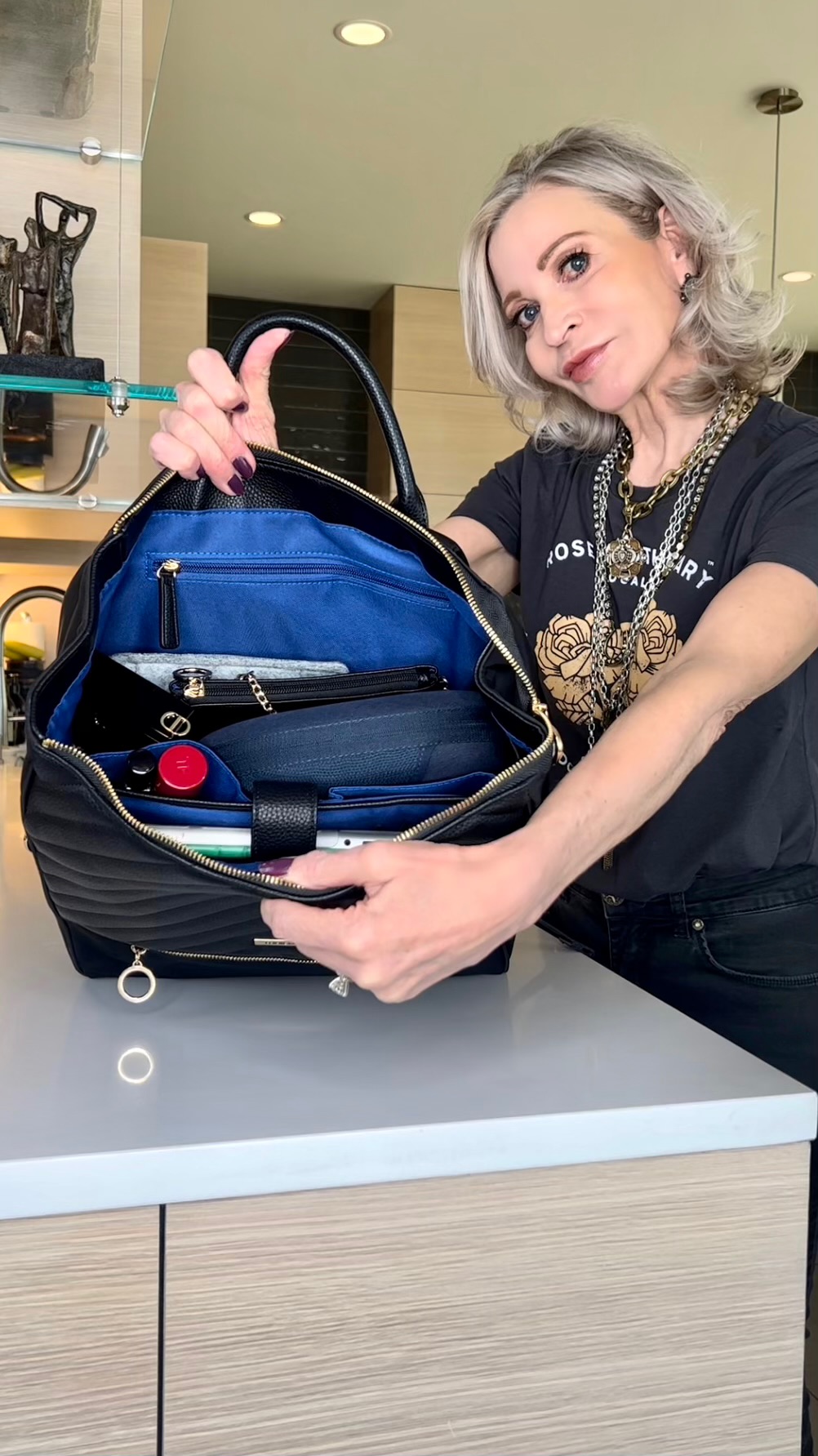 Lifestyle Influencer, Jamie Lewinger of More Than Turquoise showing inside of  the MinkeeBlue Amber  backpack 