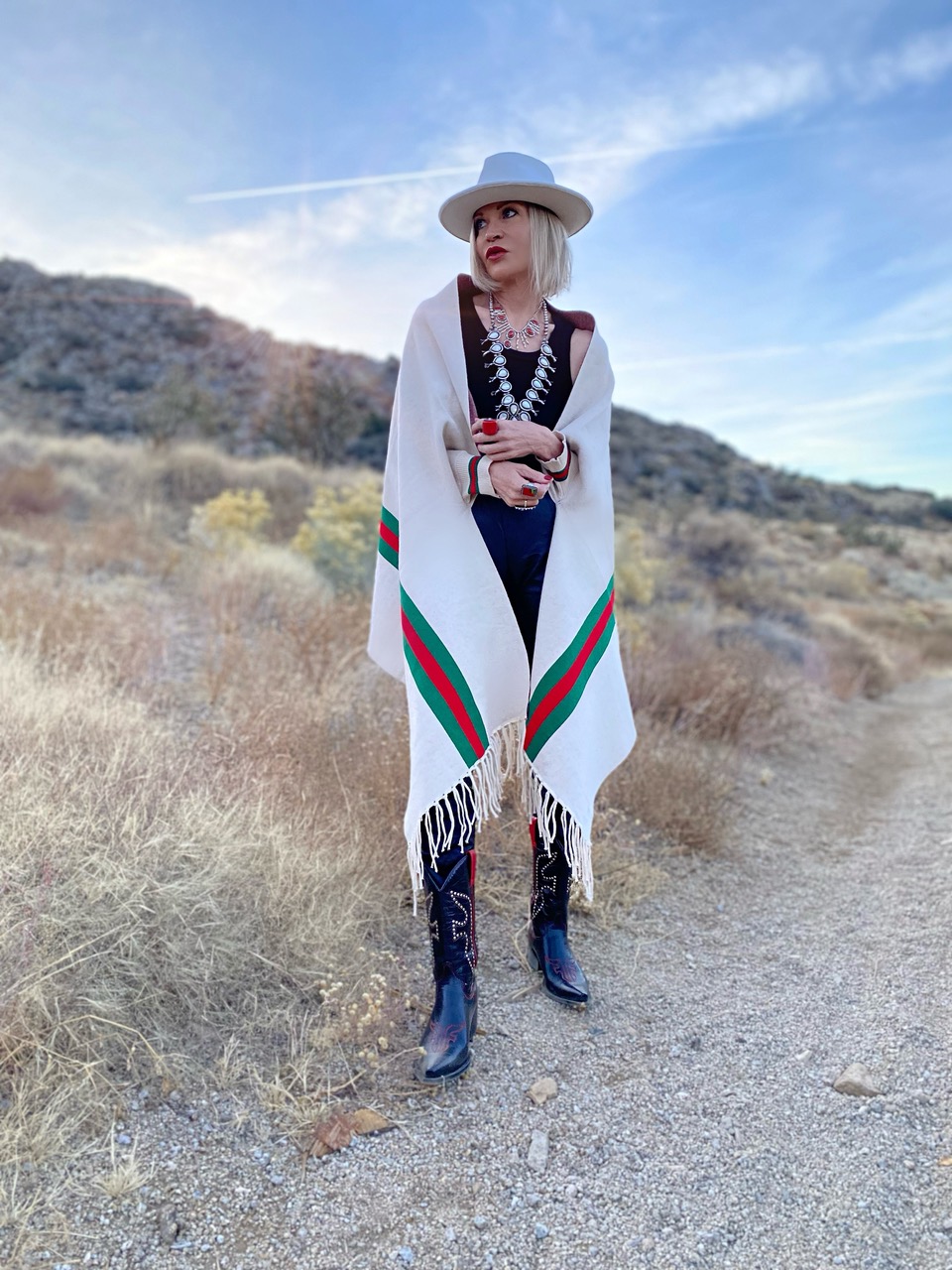 Lifestyle Influencer, Jamie Lewinger of More Than Turquoise, weary striped poncho from Pink Pineapple 