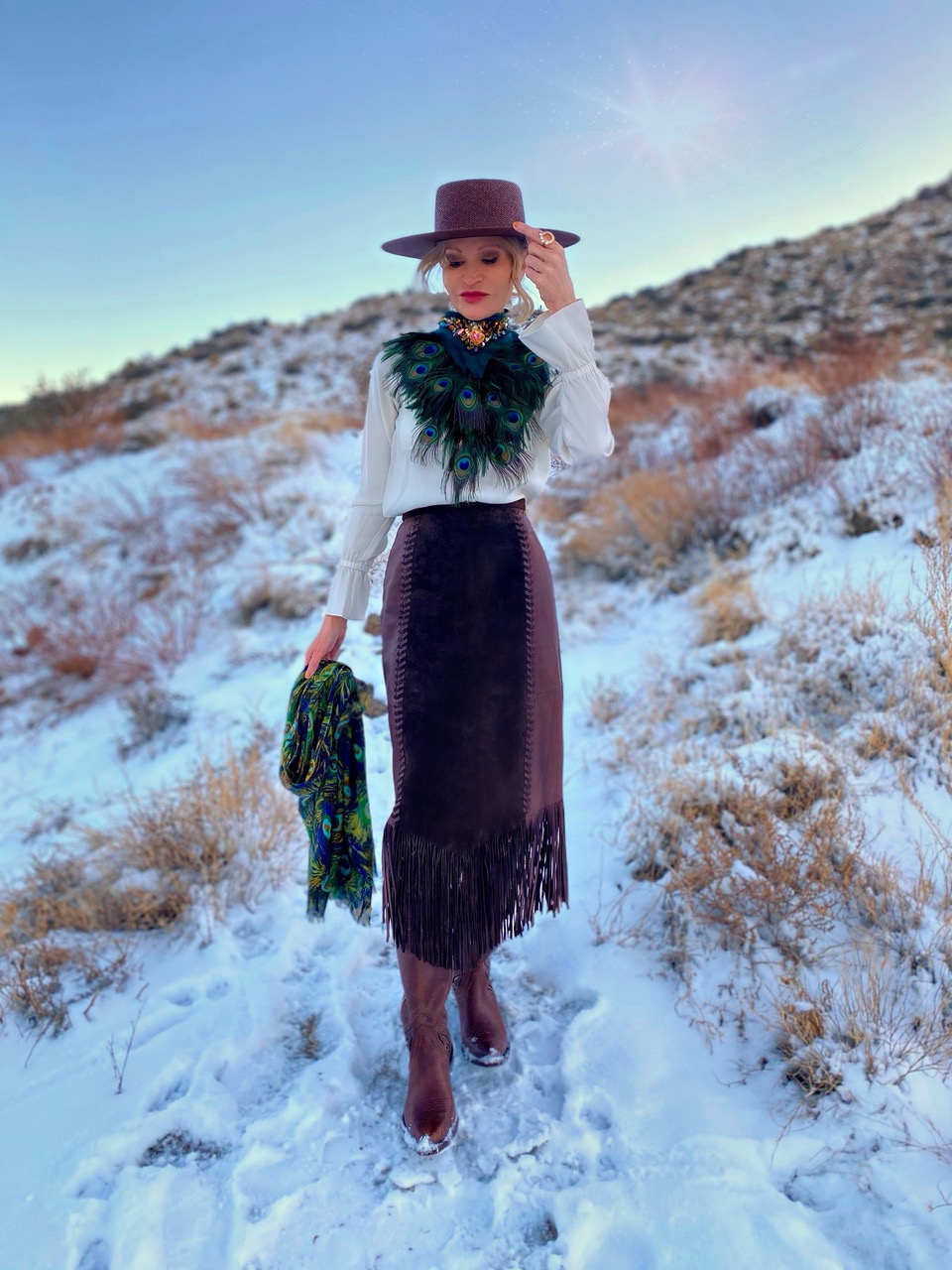 Lifestyle Influencer, Jamie Lewinger of More Than Turquoise, wearing a peacock feather neckpiece from J Ewing Designs 