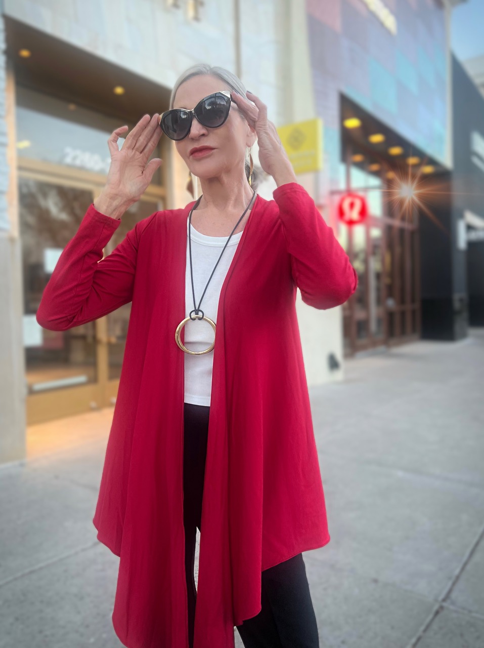 Lifestyle Influencer, Jamie Lewinger of More Than Turquoise wearing Diane Kroe wrap top & Pamela Lauz Synergy cuff
