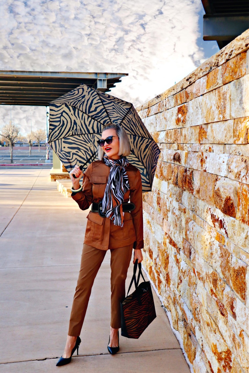 Lifestyle Influencer, Jamie Lewinger of More Than Turquoise, carrying chico's zebra-print umbrella 