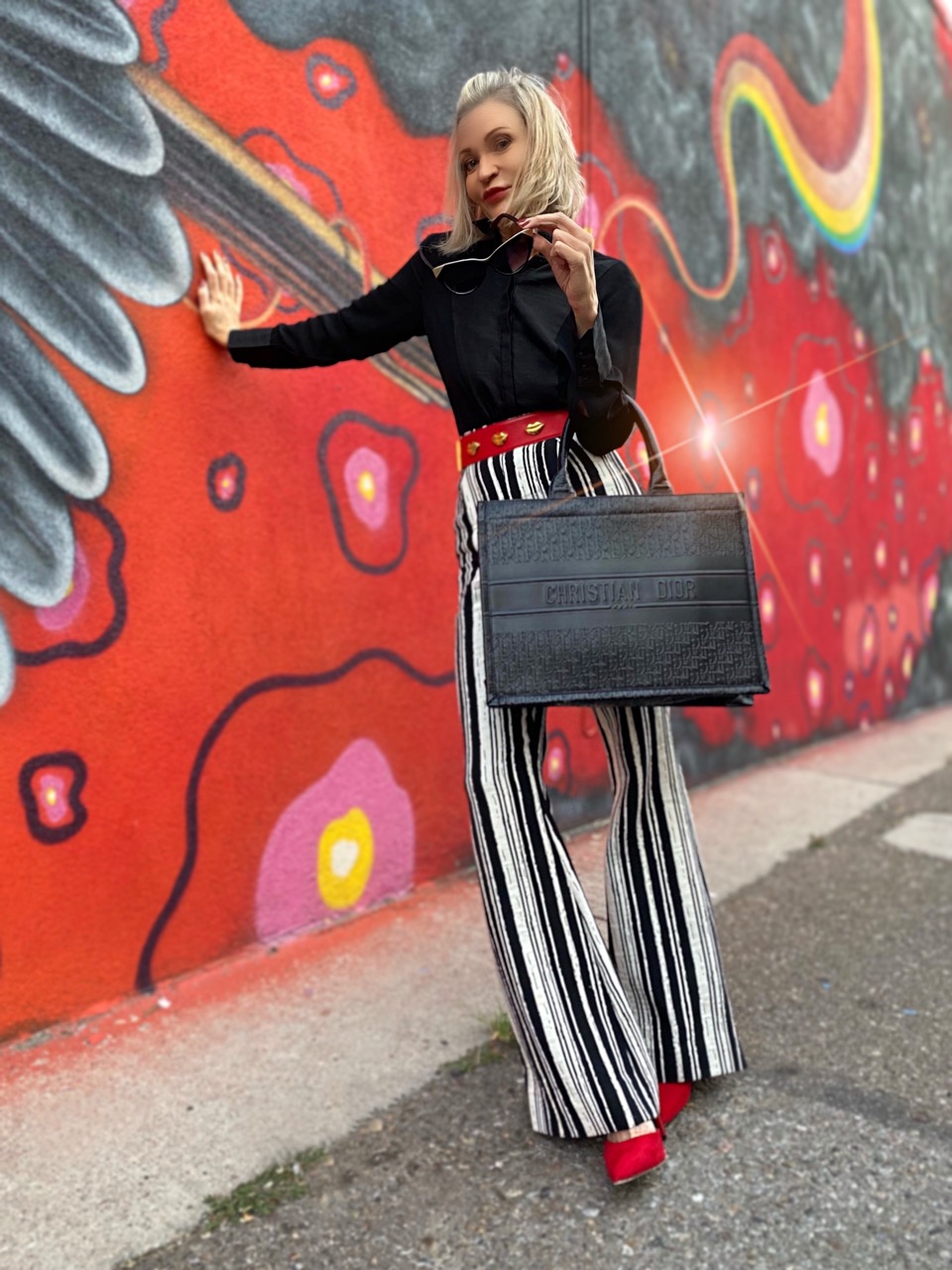 Lifestyle Influencer, Jamie Lewinger of More Than Turquoise, carryin dior dupe tote bag from Fashions Outlet Supply