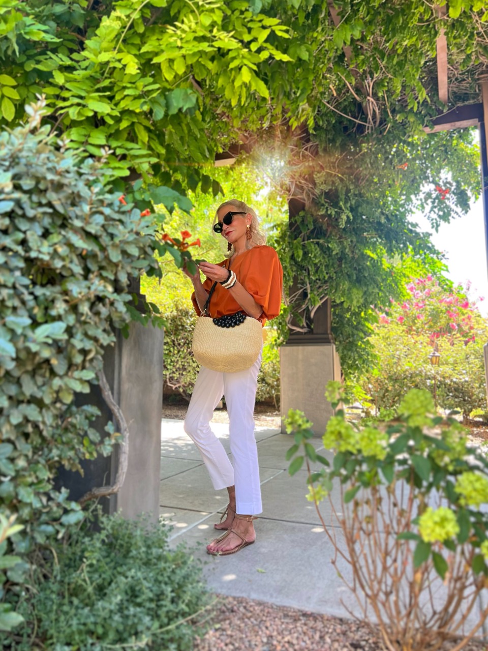 Lifestyle Influencer, Jamie Lewinger of More Than Turquoise wearing No Iron Stretch Pullover top  from Chico's in Ginger