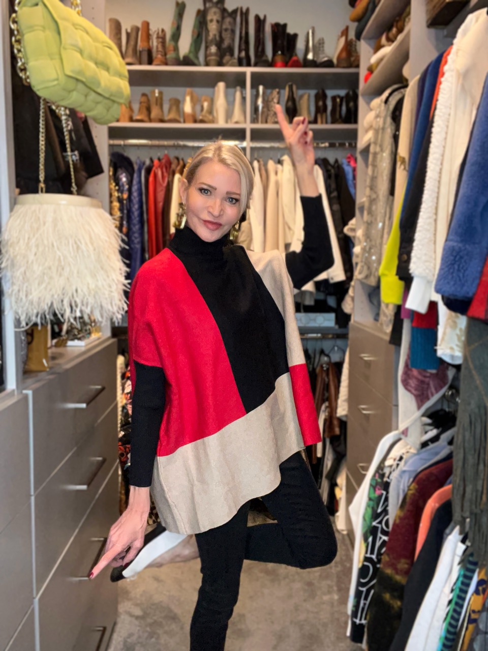 Lifestyle Influencer, Jamie Lewinger of More Than Turquoise wearing colorblock pullover sweater from Chicos