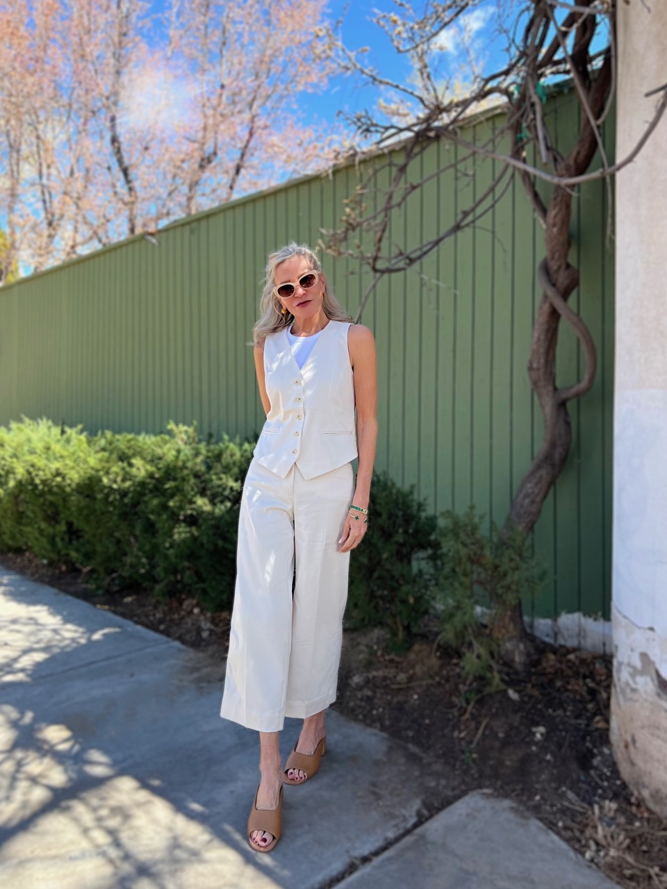 Lifestyle Influencer. Jamie Lewinger of More Than Turquoise wearing sateen stretch vest from Chico's
