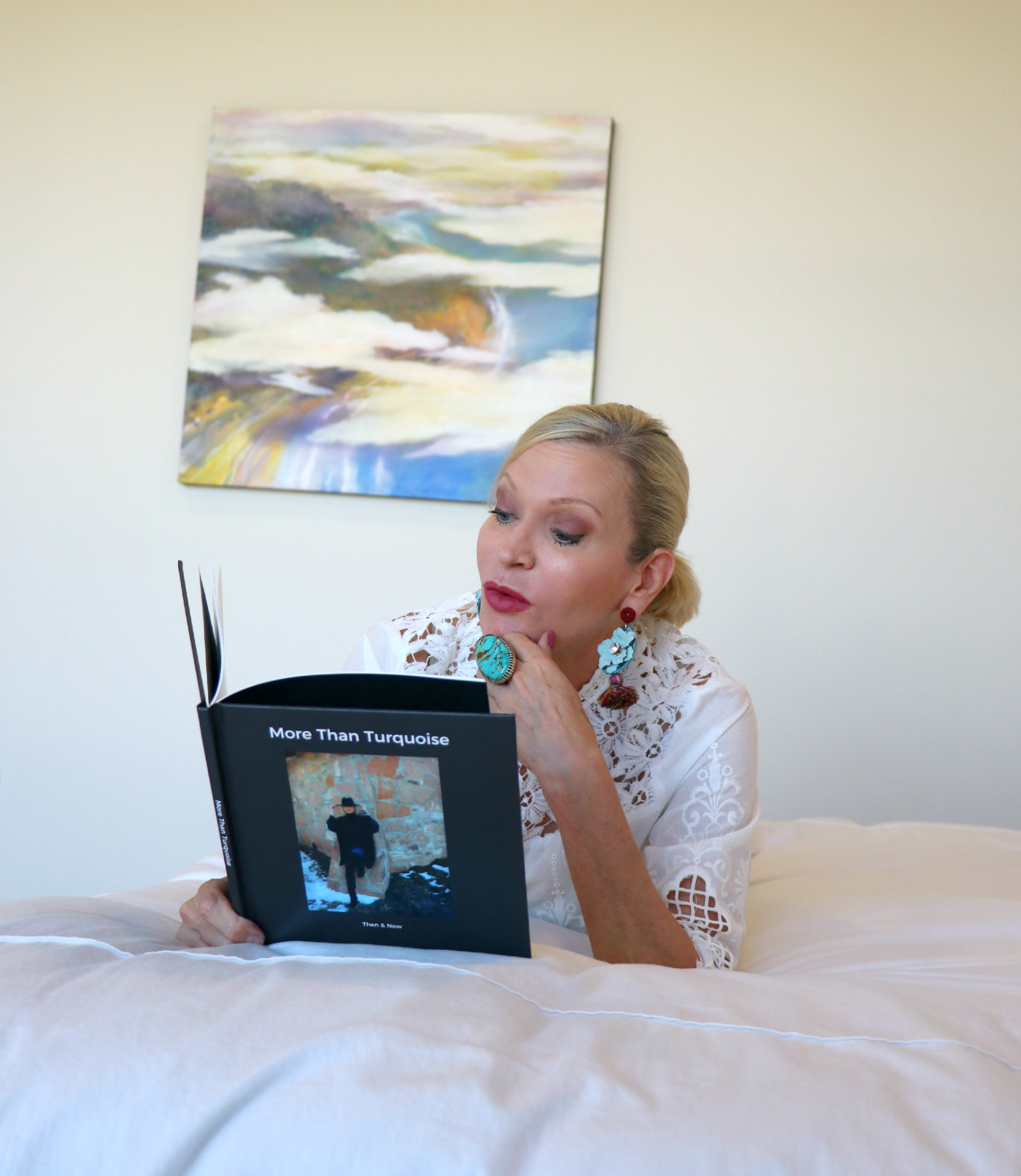 Lifestyle Influencer, Jamie Lewinger of More Than Turquoise, enjoying her custom Confetti photobook 
