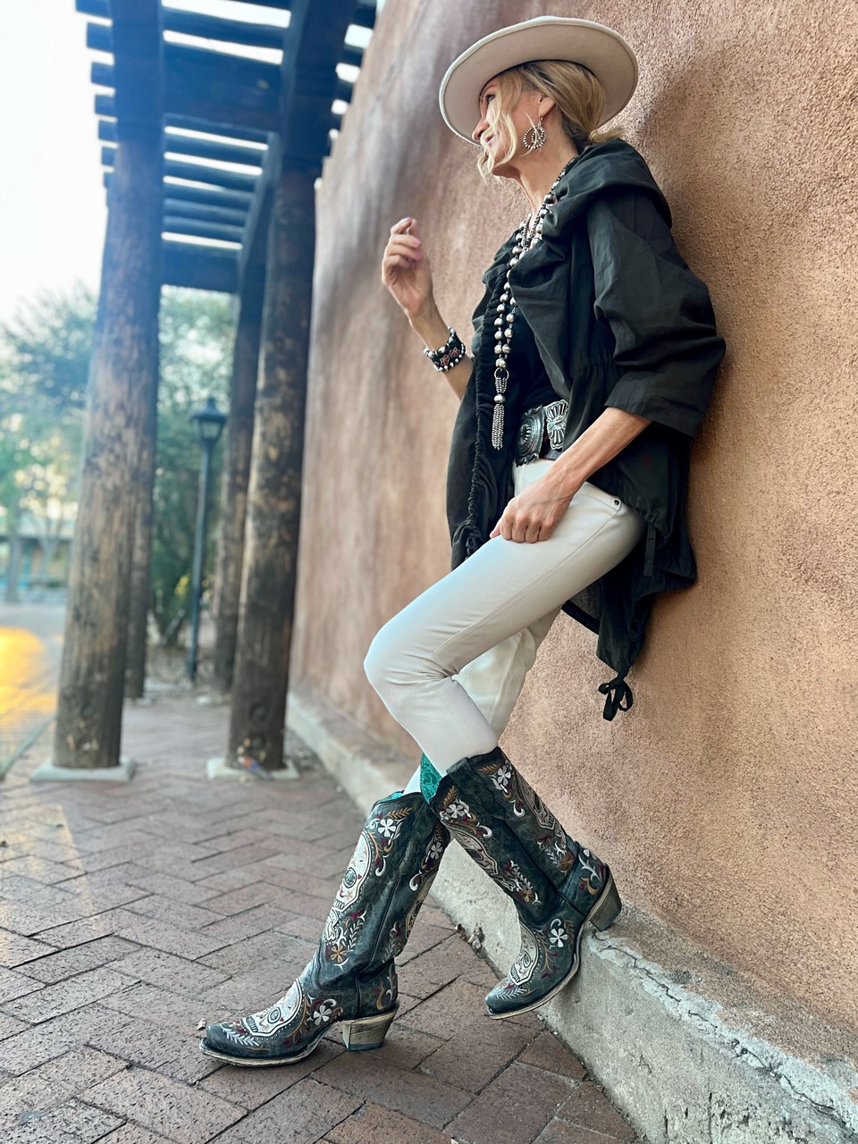 Lifestyle Influencer, Jamie Lewinger of More Than Turquoise wearing Corral Western Boots with skull