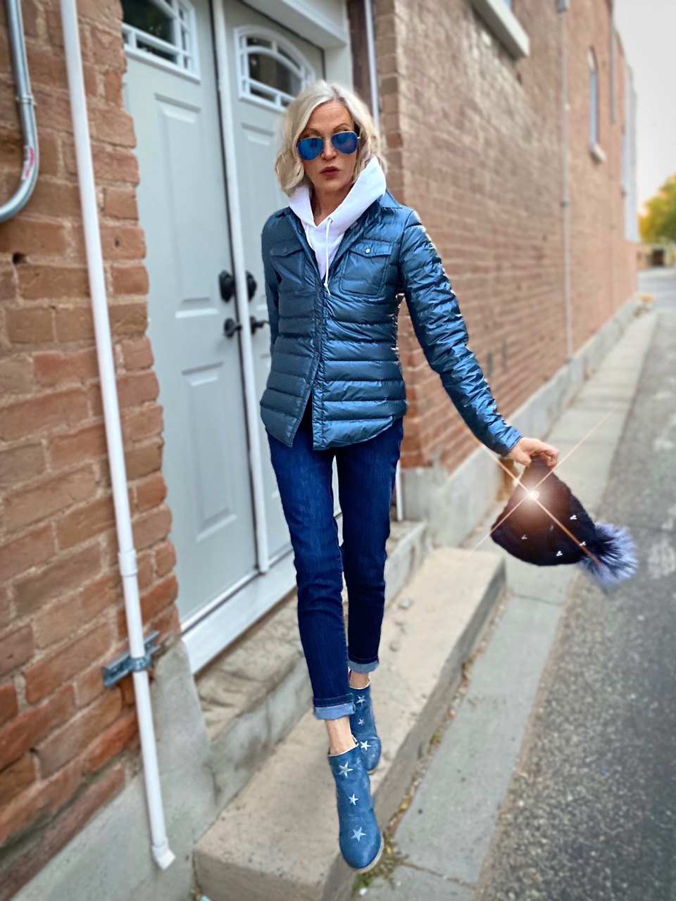 Lifestyle Influencer, Jamie Lewinger of More Than Turquoise wearing blue harrow royale down shirt from Cotes of London 