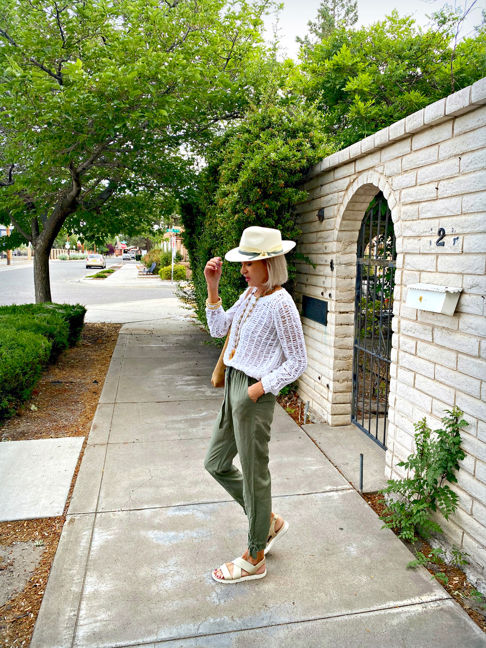 Lifestyle Influencer, Jamie Lewinger of More Than Turquoise wearing straw Tenth Street hat