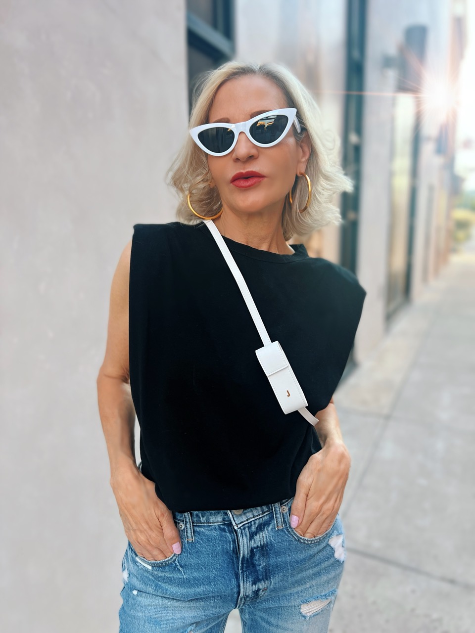 Lifestyle Influencer, Jamie Lewinger of More Than Turquoise wearing Jacquemus lipstick holder  from Italist 
