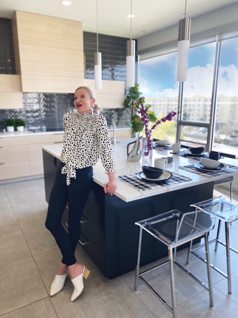 lifestyle influencer Jamie Lewinger of More Than Turquoise wearing SheIn Dalmatian print tie shirred blouse