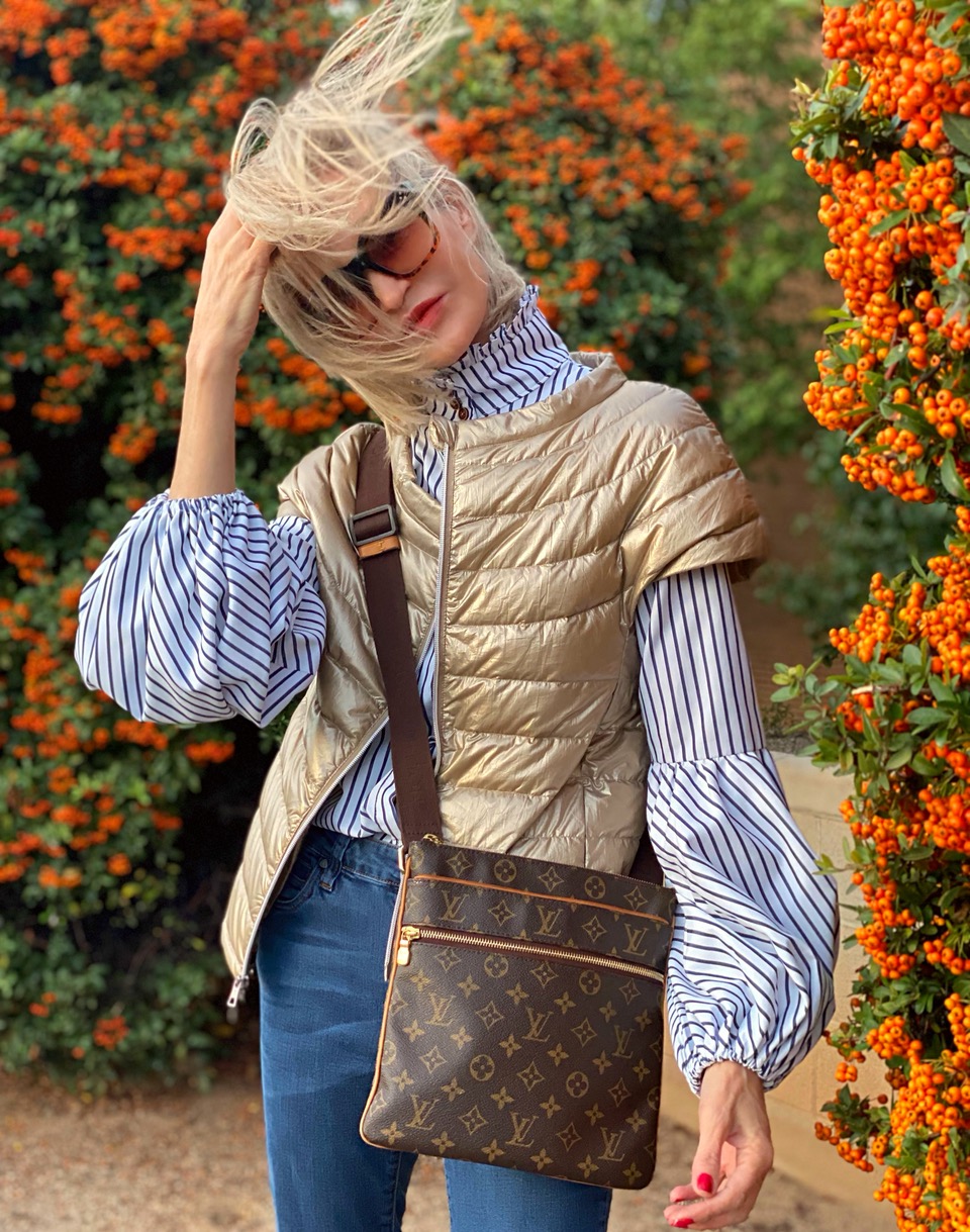 Lifestyle Influencer, Jamie Lewinger of More Than Turquoise, wearing the St Ives down vest from Cotes of London in  camel