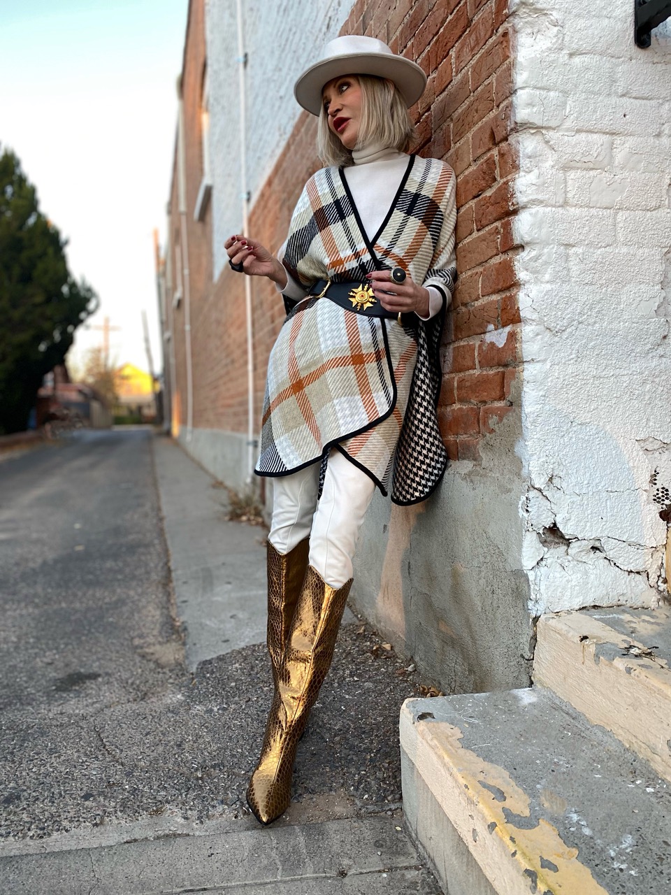 Lifestyle Influencer, jamie Lewinger of More Than Turquoise wearing Schutz gold boots 