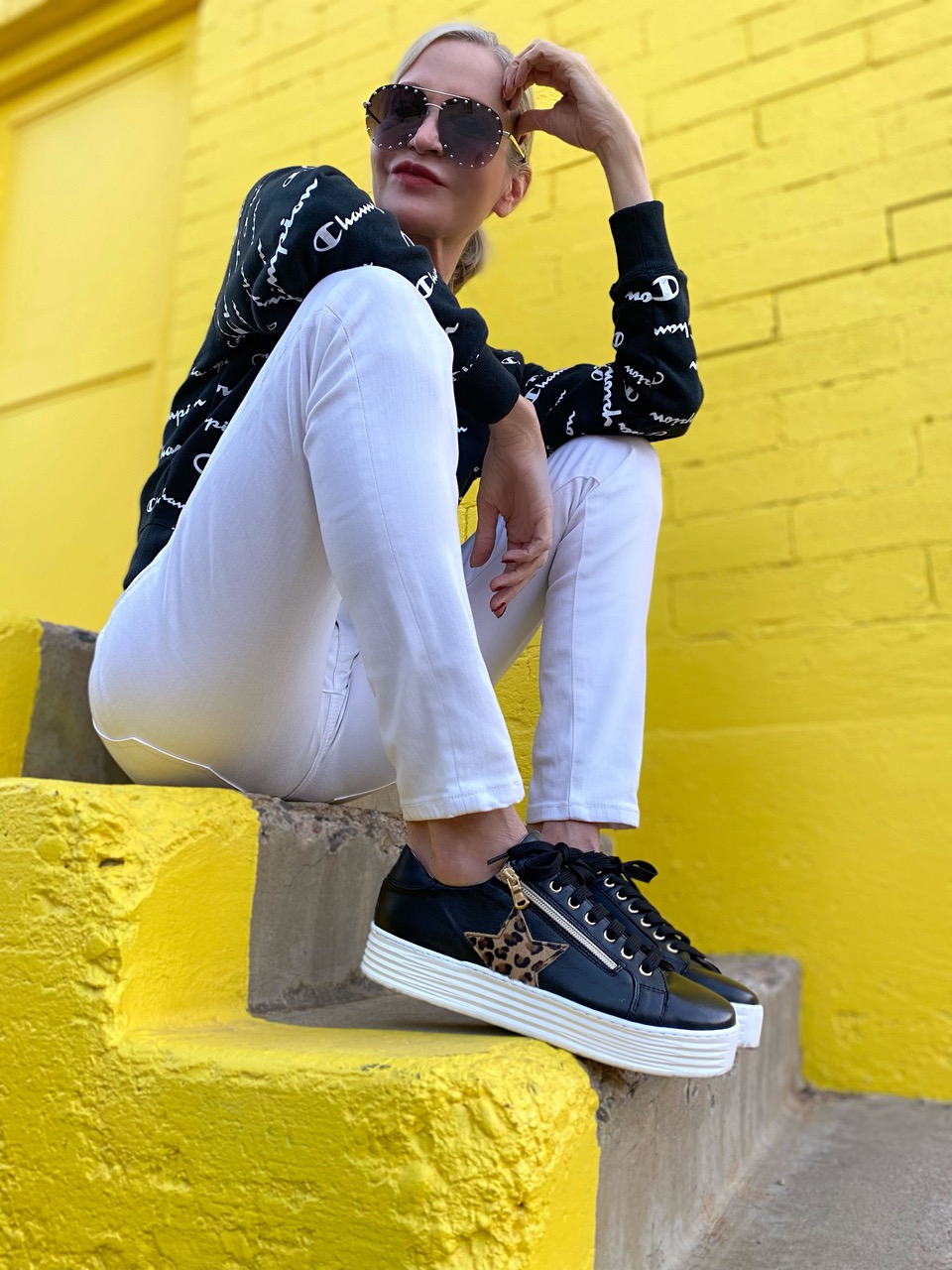 Lifestyle Influencer, Jamie Lewinger of More Than Turquoise, wearing Star sneakers in black leather & luxe leopard from Sole bliss
