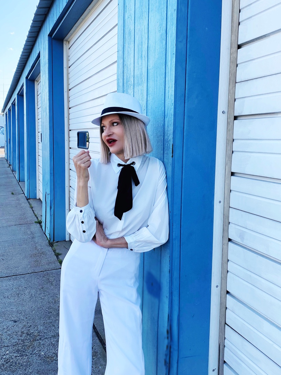 Lifestyle Influencer, Jamie Lewinger of More Than Turquoise, wearing Shein white bow blouse