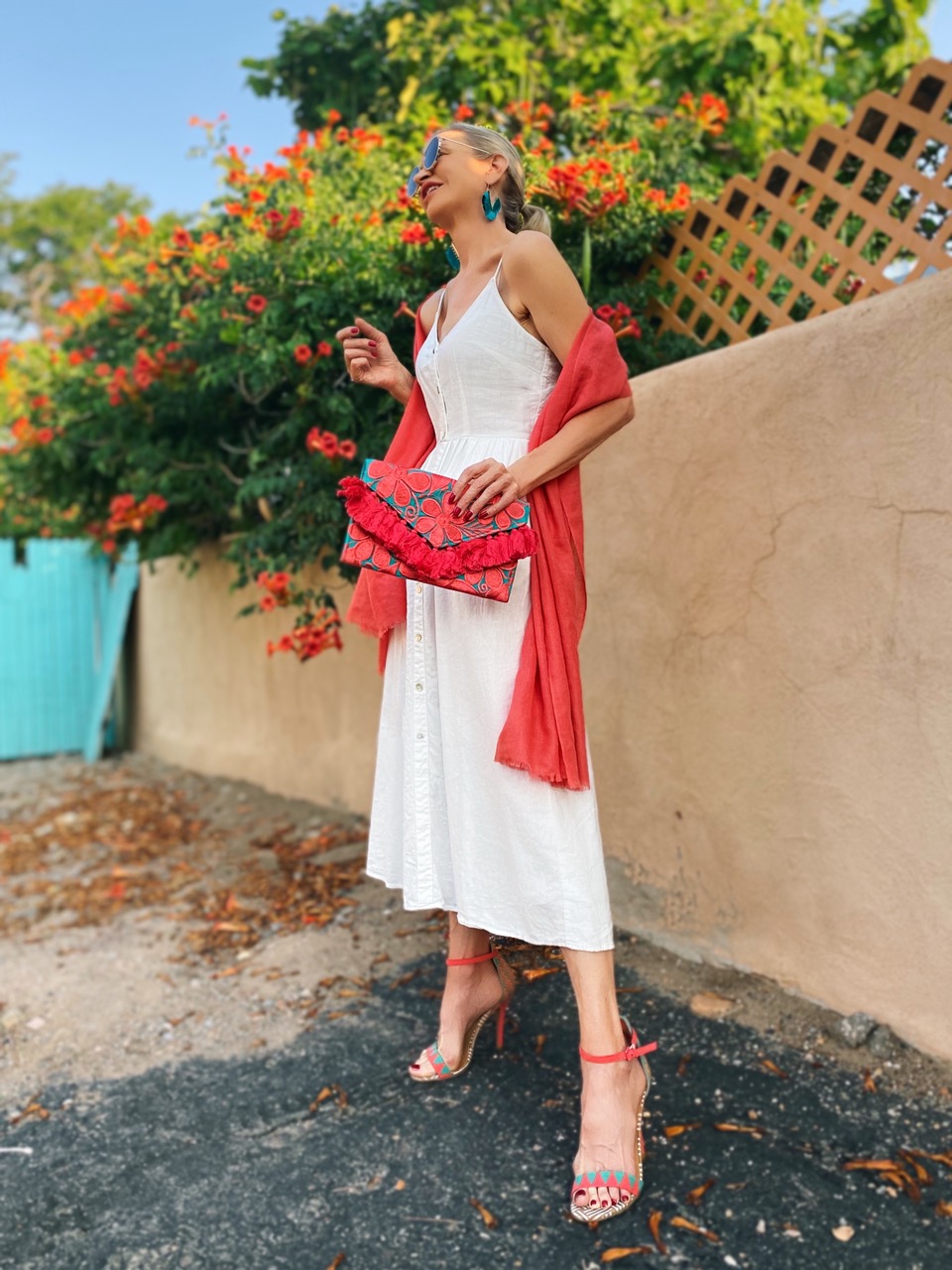 Lifestyle Influencer, Jamie Lewinger of More Than Turquoise carrying cotton floral clutch from Novica